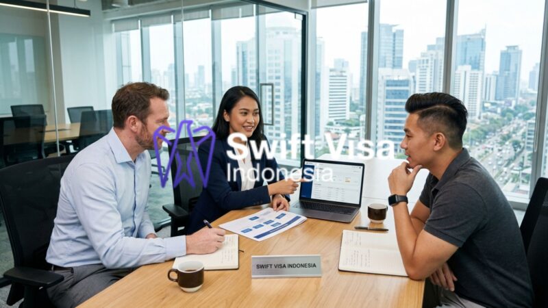 A corporate HR Manager discussing the Indonesia work permit process for a multinational team at a modern office.