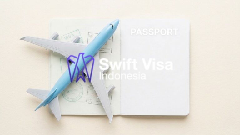 A minimalist view of a light blue model airplane on an open passport with visa stamps, representing enterprise work permit Indonesia solutions and global mobility.